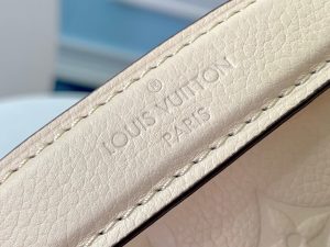 LOUIS VUITTON Pochette Métis Monogram Empreinte Leather. Authentic quality luxury bag crafted in genuine leather comes with authenticity card, dust bag and gift bag. Elegance meets functionality. The epitome of grace and sophistication is embodied in the dainty silhouette of the Pochette Métis. Crafted from supple Monogram empreinte leather, its petite proportions unveil a plethora of practical pockets and compartments. - KRIS + KIKO High quality designer bags and authentic luxury