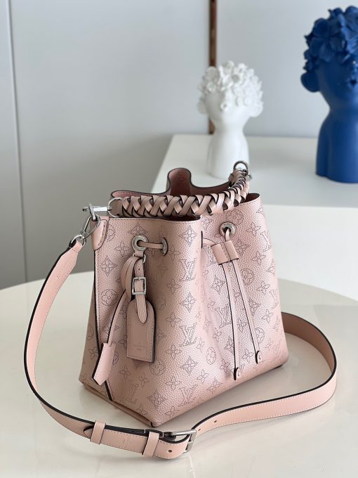 LOUIS VUITTON Muria. Authentic quality luxury bag crafted in genuine leather comes with authenticity card, dust bag and gift bag. A Fashionable Fusion of Colors and Craftsmanship! Introducing the Muria bucket bag, crafted from a refreshing Mahina perforated leather in a unique blend of blue, red, and caramel hues. Each tiny hole intricately hand-dyed, this striking tricolor rendition of the iconic Monogram pattern adds a vibrant flair to the supple calf leather. Completing the ensemble, the bag features a beautifully braided top handle.