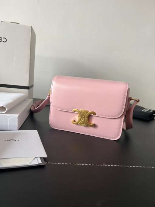CELINE Teen Triomphe. Authentic quality luxury bag crafted in genuine leather comes with authenticity card, dust bag and gift bag. Where timeless elegance meets fashion-forward sophistication. The original Triomphe, launched by Hedi Slimane in 2018, garnered widespread praise. Since then, this chic handbag has become a favorite amongst celebrities and fashion insiders worldwide. Its sleek leather exterior and understated hardware effortlessly merge style and practicality, beautifully accentuated by Celine's iconic golden Triomphe logo fastener. This exquisite design has captivated the interest of bag collectors and fashion historians alike, thanks to its sophisticated yet uncomplicated aesthetic. The timeless appeal of this classic piece has even inspired a range of spinoffs, solidifying the Triomphe's status as a revered fashion icon.