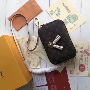 LOUIS VUITTON Saintonge Monogram Canvas Crossbody Bag. Authentic quality luxury bag crafted in genuine leather comes with authenticity card, dust bag and gift bag. Unleash Your Youthful Style. The Saintonge, a stylishly compact bag, harmoniously blends the iconic Monogram canvas with smooth calfskin, radiating a youthful energy. Enhanced by the luxurious leather, the design exudes a striking contrast and amplified volume, while the delightful tassels add a playful element. Offering versatility, the bag can be worn elegantly by its top handle or effortlessly transformed into a crossbody or shoulder bag with the included long strap. - KRIS + KIKO LOUIS VUITTON Saintonge Monogram Canvas Crossbody Bag. Original Quality Bag. Authentic calf leather trim and monogram coated canvas. Gold-toned Hardware. LOUIS VUITTON Sales Box and Dust Bag. Booklet, Authenticity Card, Payment Slip. Monogram canvas and smooth calfskin combine in the Saintonge, a compact bag with a youthful vibe. The leather lends contrast and volume to the design, and the tassels are a playful touch. With its top handle and long strap, the bag can be worn with top handle or as crossbody and shoulder bag.
