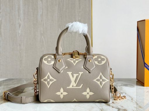 LOUIS VUITTON Speedy Bandoulière 20. Authentic quality luxury bag crafted in genuine leather comes with authenticity card, dust bag and gift bag. Experience elegance and sophistication with this timeless designer handbag. This is an iconic and stylish designer handbag, perfect for any fashionable woman. The Speedy Bandoulière 20 has all the features that make LV such a sought-after luxury brand. This bag has a resilient material, deep pockets, a spacious interior, and an adjustable shoulder strap. The exterior is crafted from durable and elegant Monogram canvas, giving it a timeless style that will last for years. It also features a discreet Lozine trim, making it both striking and sophisticated. Inside, it is lined with matching textiles with a pocket for small items, ensuring all your essentials are secure and organized. The adjustable strap allows you to wear the bag on the shoulder or carry it as a top handle bag, making it perfect for either day or night. And with a zip closure, you can always rest assured that all your items are safely contained. The Speedy Bandoulière 20 is sure to add a touch of luxury to any look.
