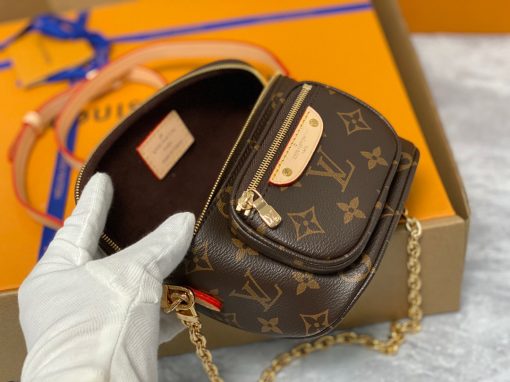 LOUIS VUITTON Mini Bumbag. Authentic quality luxury bag crafted in genuine leather comes with authenticity card, dust bag and gift bag. Embrace elegance and style, perfect for every occasion. Introducing the Mini Bumbag from LV's exquisite Gradient Collection, a beautifully designed bag that perfectly captures the current fashion trend. Detailed with Monogram Empreinte leather displaying an enchanting color gradient, this bag effortlessly elevates your accessory collection. The main compartment is secured by a zip closure, accompanied by a front pocket embellished with an elegant Louis Vuitton leather tag. For ultimate versatility, adjustable and removable straps allow for both cross-body and shoulder wear. To complete its charm, this Mini Bumbag is complemented by a chic gold-tone chain, making it a must-have accessory for any summer occasion.