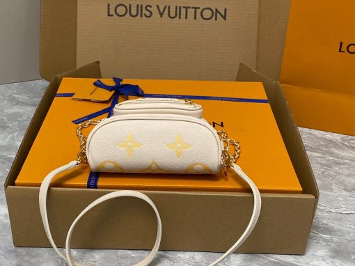 LOUIS VUITTON Mini Bumbag. Authentic quality luxury bag crafted in genuine leather comes with authenticity card, dust bag and gift bag. Embrace elegance and style, perfect for every occasion. Introducing the Mini Bumbag from LV's exquisite Gradient Collection, a beautifully designed bag that perfectly captures the current fashion trend. Detailed with Monogram Empreinte leather displaying an enchanting color gradient, this bag effortlessly elevates your accessory collection. The main compartment is secured by a zip closure, accompanied by a front pocket embellished with an elegant Louis Vuitton leather tag. For ultimate versatility, adjustable and removable straps allow for both cross-body and shoulder wear. To complete its charm, this Mini Bumbag is complemented by a chic gold-tone chain, making it a must-have accessory for any summer occasion.