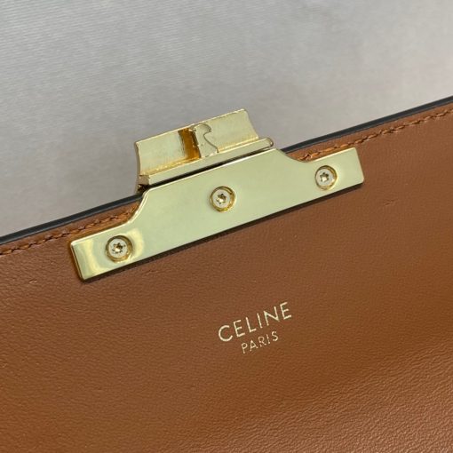 CELINE Chain Shoulder Bag Triomphe In Shiny Calfskin. Authentic quality luxury bag crafted in genuine leather comes with authenticity card, dust bag and gift bag. Effortlessly chic: your perfect companion for everyday elegance. Introducing an exquisite and versatile handbag designed for daily use - the Celine Chain Bag. With its clean and elegant silhouette, this bag is enhanced by a front flap adorned with a stunning Triomphe Metallic Closure. Crafted with utmost attention to detail, it is available in two luxurious materials: Canvas or Calfskin Leather. For added convenience, this bag comes with a drop chain, allowing you to effortlessly carry it as a shoulder or cross body bag. Whether you're attending an evening event or a formal gathering, the Celine Chain Bag will gracefully accompany you. Upon opening the flap, you will discover a spacious main compartment and a handy flat pocket, providing ample storage for your necessities.