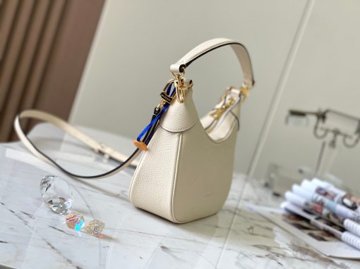 LOUIS VUITTON Bagatelle. Authentic quality luxury bag crafted in genuine leather comes with authenticity card, dust bag and gift bag. Bringing Luxury and Versatility Together in One Bag. The Bagatelle mini hobo handbag is a sophisticated and stylish choice for the modern woman. It features luxe Monogram Empreinte leather crafted with a distinctive embossed pattern. The bag has a hobo shape with curved edges giving it an elegant and timeless appeal. Furthermore, the bag comes with a detachable, adjustable strap, allowing you to carry it in multiple ways – as a baguette-hobo, on the elbow, or cross-body. With this bag, you’ll be well prepared for any occasion you may face.
