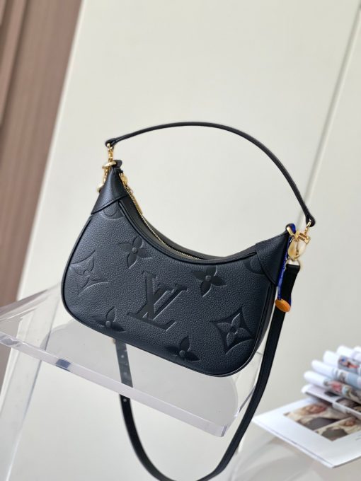 LOUIS VUITTON Bagatelle. Authentic quality luxury bag crafted in genuine leather comes with authenticity card, dust bag and gift bag. Bringing Luxury and Versatility Together in One Bag. The Bagatelle mini hobo handbag is a sophisticated and stylish choice for the modern woman. It features luxe Monogram Empreinte leather crafted with a distinctive embossed pattern. The bag has a hobo shape with curved edges giving it an elegant and timeless appeal. Furthermore, the bag comes with a detachable, adjustable strap, allowing you to carry it in multiple ways – as a baguette-hobo, on the elbow, or cross-body. With this bag, you’ll be well prepared for any occasion you may face.