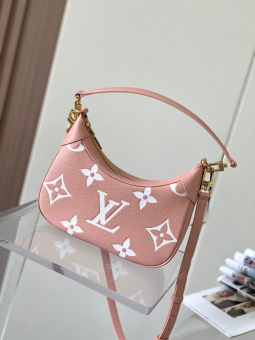 LOUIS VUITTON Bagatelle. Authentic quality luxury bag crafted in genuine leather comes with authenticity card, dust bag and gift bag. Bringing Luxury and Versatility Together in One Bag. The Bagatelle mini hobo handbag is a sophisticated and stylish choice for the modern woman. It features luxe Monogram Empreinte leather crafted with a distinctive embossed pattern. The bag has a hobo shape with curved edges giving it an elegant and timeless appeal. Furthermore, the bag comes with a detachable, adjustable strap, allowing you to carry it in multiple ways – as a baguette-hobo, on the elbow, or cross-body. With this bag, you’ll be well prepared for any occasion you may face.