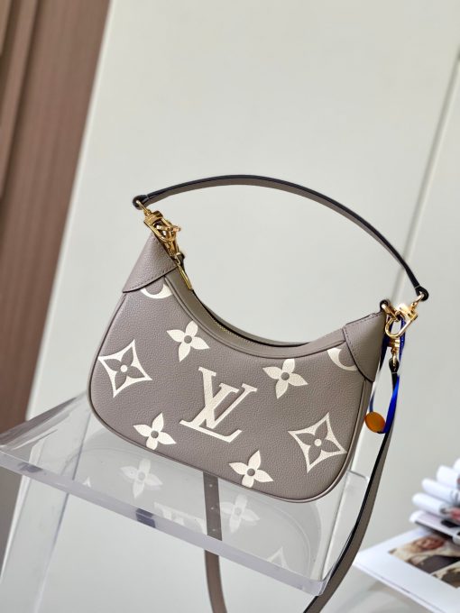 LOUIS VUITTON Bagatelle. Authentic quality luxury bag crafted in genuine leather comes with authenticity card, dust bag and gift bag. Bringing Luxury and Versatility Together in One Bag. The Bagatelle mini hobo handbag is a sophisticated and stylish choice for the modern woman. It features luxe Monogram Empreinte leather crafted with a distinctive embossed pattern. The bag has a hobo shape with curved edges giving it an elegant and timeless appeal. Furthermore, the bag comes with a detachable, adjustable strap, allowing you to carry it in multiple ways – as a baguette-hobo, on the elbow, or cross-body. With this bag, you’ll be well prepared for any occasion you may face.