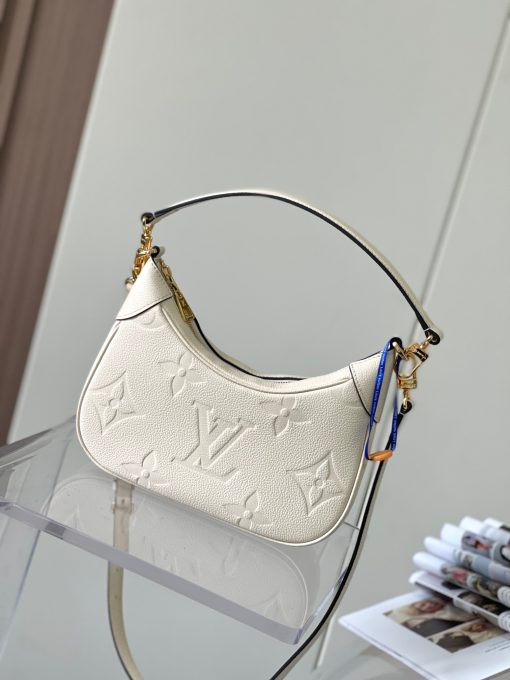 LOUIS VUITTON Bagatelle. Authentic quality luxury bag crafted in genuine leather comes with authenticity card, dust bag and gift bag. Bringing Luxury and Versatility Together in One Bag. The Bagatelle mini hobo handbag is a sophisticated and stylish choice for the modern woman. It features luxe Monogram Empreinte leather crafted with a distinctive embossed pattern. The bag has a hobo shape with curved edges giving it an elegant and timeless appeal. Furthermore, the bag comes with a detachable, adjustable strap, allowing you to carry it in multiple ways – as a baguette-hobo, on the elbow, or cross-body. With this bag, you’ll be well prepared for any occasion you may face.