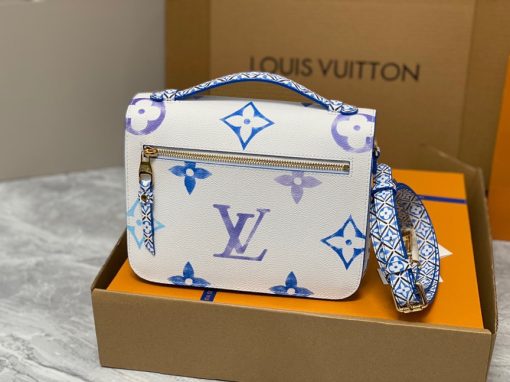 LOUIS VUITTON Pochette Métis MM. Authentic quality luxury bag crafted in genuine leather comes with authenticity card, dust bag and gift bag. Style with a Portuguese Touch. This exquisite Pochette Metis handbag is crafted from cream-colored canvas and highlighted by pastel LV's and Monogram Flowers printed with a watercolor-like effect. The top handle and detachable strap present a more prominent Monogram Flower pattern, reminiscent of the Portuguese painted ceramic tilework.