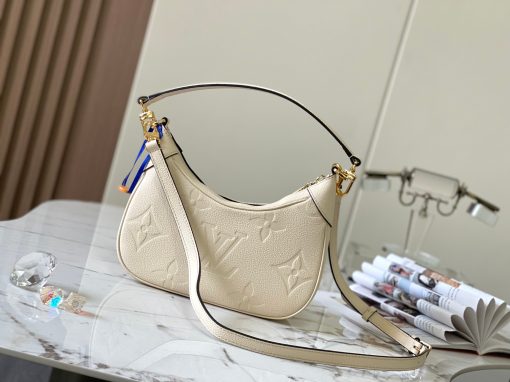 LOUIS VUITTON Bagatelle. Authentic quality luxury bag crafted in genuine leather comes with authenticity card, dust bag and gift bag. Bringing Luxury and Versatility Together in One Bag. The Bagatelle mini hobo handbag is a sophisticated and stylish choice for the modern woman. It features luxe Monogram Empreinte leather crafted with a distinctive embossed pattern. The bag has a hobo shape with curved edges giving it an elegant and timeless appeal. Furthermore, the bag comes with a detachable, adjustable strap, allowing you to carry it in multiple ways – as a baguette-hobo, on the elbow, or cross-body. With this bag, you’ll be well prepared for any occasion you may face.
