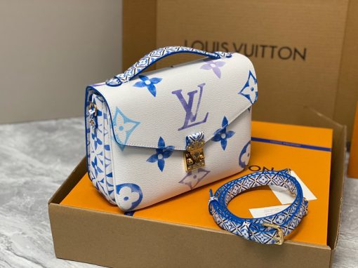 LOUIS VUITTON Pochette Métis MM. Authentic quality luxury bag crafted in genuine leather comes with authenticity card, dust bag and gift bag. Style with a Portuguese Touch. This exquisite Pochette Metis handbag is crafted from cream-colored canvas and highlighted by pastel LV's and Monogram Flowers printed with a watercolor-like effect. The top handle and detachable strap present a more prominent Monogram Flower pattern, reminiscent of the Portuguese painted ceramic tilework.
