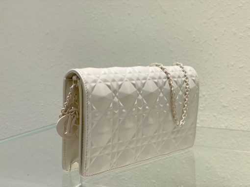 DIOR Lady Dior Pouch. Authentic quality luxury bag crafted in genuine leather comes with authenticity card, dust bag and gift bag. Embrace timeless elegance! The exquisite Lady Dior pouch, handcrafted with the finest calfskin, is easily recognized by its elegant Cannage topstitching embellished with a beautiful Diamond motif, along with a delightful detachable 'D.I.O.R.' charm. This extraordinary accessory offers versatility as it can be worn with or without its chain strap, and it incorporates two detachable components - a practical card holder and a convenient zipped pouch. Each of these elements can be carried individually for added convenience. Adorned with the iconic House motif presented in a striking graphic design, this pouch is sure to make a statement and effortlessly complements other pieces from the same collection.