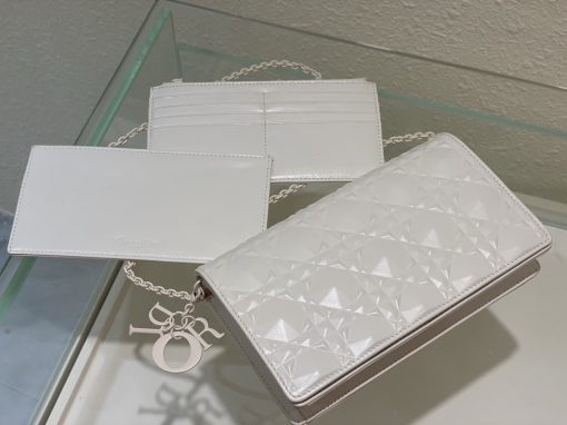 DIOR Lady Dior Pouch. Authentic quality luxury bag crafted in genuine leather comes with authenticity card, dust bag and gift bag. Embrace timeless elegance! The exquisite Lady Dior pouch, handcrafted with the finest calfskin, is easily recognized by its elegant Cannage topstitching embellished with a beautiful Diamond motif, along with a delightful detachable 'D.I.O.R.' charm. This extraordinary accessory offers versatility as it can be worn with or without its chain strap, and it incorporates two detachable components - a practical card holder and a convenient zipped pouch. Each of these elements can be carried individually for added convenience. Adorned with the iconic House motif presented in a striking graphic design, this pouch is sure to make a statement and effortlessly complements other pieces from the same collection.
