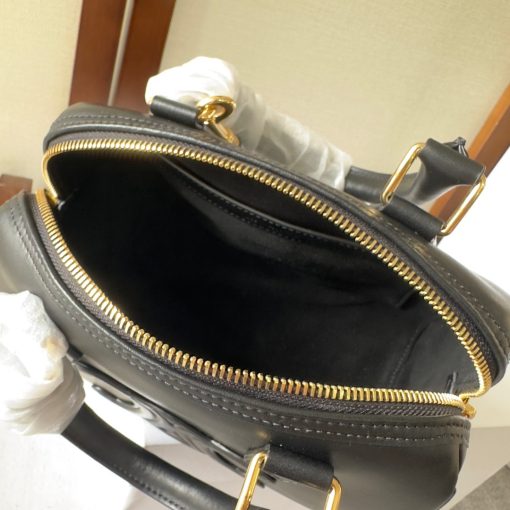 CELINE Small Boston Cuir Triomphe. Authentic quality luxury bag crafted in genuine leather comes with authenticity card, dust bag and gift bag. Style meets sophistication with this timeless bag. This is a classic accessory which is perfect for both day and night. It is made out of smooth calfskin leather with a stitched monogram pattern that creates an elegant, modern look. The bag features a removable and adjustable shoulder strap, a top handle for carrying, and a zipped closure. It also has a main spacious compartment, and one inner flat pocket. It has a small and compact size, perfect for days when you don't want to carry too much. The timeless design will never go out of style, and you'll be sure to feel confident and stylish with this bag on your arm.