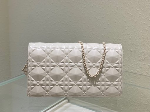 DIOR Lady Dior Pouch. Authentic quality luxury bag crafted in genuine leather comes with authenticity card, dust bag and gift bag. Embrace timeless elegance! The exquisite Lady Dior pouch, handcrafted with the finest calfskin, is easily recognized by its elegant Cannage topstitching embellished with a beautiful Diamond motif, along with a delightful detachable 'D.I.O.R.' charm. This extraordinary accessory offers versatility as it can be worn with or without its chain strap, and it incorporates two detachable components - a practical card holder and a convenient zipped pouch. Each of these elements can be carried individually for added convenience. Adorned with the iconic House motif presented in a striking graphic design, this pouch is sure to make a statement and effortlessly complements other pieces from the same collection.
