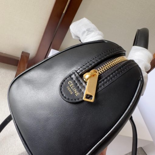 CELINE Small Boston Cuir Triomphe. Authentic quality luxury bag crafted in genuine leather comes with authenticity card, dust bag and gift bag. Style meets sophistication with this timeless bag. This is a classic accessory which is perfect for both day and night. It is made out of smooth calfskin leather with a stitched monogram pattern that creates an elegant, modern look. The bag features a removable and adjustable shoulder strap, a top handle for carrying, and a zipped closure. It also has a main spacious compartment, and one inner flat pocket. It has a small and compact size, perfect for days when you don't want to carry too much. The timeless design will never go out of style, and you'll be sure to feel confident and stylish with this bag on your arm.