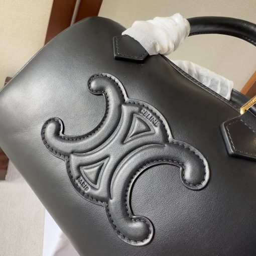 CELINE Small Boston Cuir Triomphe. Authentic quality luxury bag crafted in genuine leather comes with authenticity card, dust bag and gift bag. Style meets sophistication with this timeless bag. This is a classic accessory which is perfect for both day and night. It is made out of smooth calfskin leather with a stitched monogram pattern that creates an elegant, modern look. The bag features a removable and adjustable shoulder strap, a top handle for carrying, and a zipped closure. It also has a main spacious compartment, and one inner flat pocket. It has a small and compact size, perfect for days when you don't want to carry too much. The timeless design will never go out of style, and you'll be sure to feel confident and stylish with this bag on your arm.