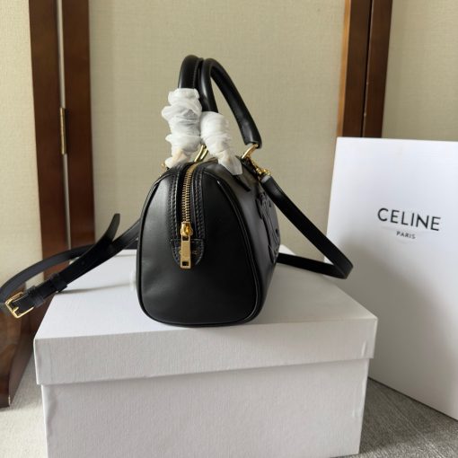 CELINE Small Boston Cuir Triomphe. Authentic quality luxury bag crafted in genuine leather comes with authenticity card, dust bag and gift bag. Style meets sophistication with this timeless bag. This is a classic accessory which is perfect for both day and night. It is made out of smooth calfskin leather with a stitched monogram pattern that creates an elegant, modern look. The bag features a removable and adjustable shoulder strap, a top handle for carrying, and a zipped closure. It also has a main spacious compartment, and one inner flat pocket. It has a small and compact size, perfect for days when you don't want to carry too much. The timeless design will never go out of style, and you'll be sure to feel confident and stylish with this bag on your arm.