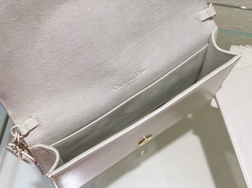 DIOR Lady Dior Pouch. Authentic quality luxury bag crafted in genuine leather comes with authenticity card, dust bag and gift bag. Embrace timeless elegance! The exquisite Lady Dior pouch, handcrafted with the finest calfskin, is easily recognized by its elegant Cannage topstitching embellished with a beautiful Diamond motif, along with a delightful detachable 'D.I.O.R.' charm. This extraordinary accessory offers versatility as it can be worn with or without its chain strap, and it incorporates two detachable components - a practical card holder and a convenient zipped pouch. Each of these elements can be carried individually for added convenience. Adorned with the iconic House motif presented in a striking graphic design, this pouch is sure to make a statement and effortlessly complements other pieces from the same collection.