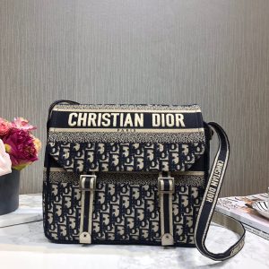 DIOR Oblique Embroidery Camp Bag. Authentic quality luxury bag crafted in genuine leather comes with authenticity card, dust bag and gift bag. Elevate Essentials in Style. Experience elegance with this meticulously designed messenger bag, crafted from exquisite Dior Oblique monogram canvas. The bag boasts a canvas shoulder strap and accentuated with aged silver hardware. Open the flap to reveal a stunningly coordinated fabric interior, offering ample space for your essentials. Embrace the beauty of simplicity with this remarkable DIOR bag, perfect for your everyday needs. - KRIS + KIKO DIOR Oblique Embroidery Camp Bag. Original Quality Bag including gift box, literature, dust bag, authenticity card. This messenger bag is finely crafted of Dior Oblique monogram canvas. The bag features a canvas shoulder strap and aged silver hardware. The flap opens to a matching fabric interior with plenty of space. This a stunning DIOR bag for just your essentials.