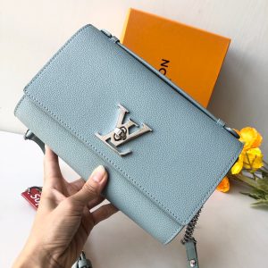 LOUIS VUITTON Lockme Clutch. Authentic quality luxury bag crafted in genuine leather comes with authenticity card, dust bag and gift bag. Unlock the Elegance. Your Day-to-Evening Statement. The Lockme Clutch is a truly eye-catching bag that seamlessly transitions from day to evening. It features the iconic LV turn lock and a luxurious leather top handle, allowing for effortless clutch carry. What sets this bag apart is its clever strap, which can be easily adjusted with press studs to achieve the perfect length for shoulder or cross-body carry. To add a touch of elegance for special evening occasions, a delicate chain is delicately attached to the end of the strap. - KRIS + KIKO LOUIS VUITTON Lockme Clutch. Authentic quality luxury bag crafted in genuine leather comes with authenticity card, dust bag and gift bag. Unlock the Elegance. Your Day-to-Evening Statement. The Lockme Clutch is a truly eye-catching bag that seamlessly transitions from day to evening. It features the iconic LV turn lock and a luxurious leather top handle, allowing for effortless clutch carry. What sets this bag apart is its clever strap, which can be easily adjusted with press studs to achieve the perfect length for shoulder or cross-body carry. To add a touch of elegance for special evening occasions, a delicate chain is delicately attached to the end of the strap.