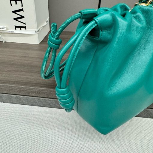 LOEWE Medium Flamenco Purse. Authentic quality luxury bag crafted in genuine leather comes with authenticity card, dust bag and gift bag. Elegant Sophistication. Meet the Flamenco Purse – where timeless style meets modern elegance. Defined by its beautifully ruched design and signature side knots, this medium-sized bag is crafted from soft, supple nappa lambskin. It's the perfect blend of luxurious texture and sophisticated detailing, making it an essential accessory for any wardrobe.