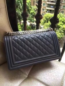 CHANEL 'Boy' Diamond Quilted Leather Flap Bag. Authentic quality luxury bag crafted in genuine leather comes with authenticity card, dust bag and gift bag. Embrace timeless elegance. The Chanel Boy Flap Bag Quilted, a creation by the visionary Karl Lagerfeld, pays tribute to Gabrielle Chanel's beloved Boy Capel. This exquisite bag, reminiscent of every woman's fantasy, is meticulously crafted from premium calfskin leather. It showcases Chanel's iconic diamond quilting, adorned with a bold chain link strap enhanced by a leather shoulder pad, and complemented by delicate metal-tone hardware accents. The bag's CC Boy logo closure gracefully reveals a fabric-lined interior, complete with a convenient slip pocket to house everyday essentials. Truly a cherished and opulent accessory coveted by many. - KRIS + KIKO CHANEL 'Boy' Diamond Quilted Leather Flap Bag. Original Quality Bag including gift box, care book, dust bag, authenticity card. Created by Karl Lagerfeld, the iconic design owes its name to Gabrielle Chanel's first love, Boy Capel. This Chanel Boy Flap Bag Quilted is every woman's dream. Crafted from calfskin leather, the bag features Chanel's signature diamond quilting, chunky chain link strap with leather shoulder pad, and metal-tone hardware accents. Its CC Boy logo closure opens to a fabric-lined interior with slip pocket perfect for daily essentials. A sought-after, luxurious accessory.