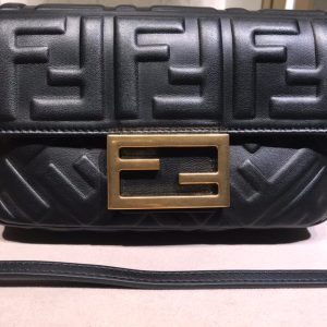 FENDI Baguette Mini. Authentic quality luxury bag crafted in genuine leather comes with authenticity card, dust bag and gift bag. The Resurgence of Elegance. The iconic Baguette bag by Fendi, which was originally created in 1997, is making a triumphant comeback amid the ongoing trend for all things from the Nineties era. This coveted bag quickly surpassed previous bag trends, becoming a phenomenon that had women yearning to possess as many designs as possible. Unlike the timeless classics such as Chanel's 2.55 and Hermes' Kelly and Birkin styles, the Baguette was a fresh and fashion-forward creation, offering both high-end elegance and trendiness. - KRIS + KIKO FENDI Baguette Mini. Original Quality Bag including gift box, literature, dust bag, authenticity card. The original It Bag is back. As the trend for everything the Nineties rolls on, it’s only right that Fendi’s iconic Baguette bag, which was created in 1997, has another turn in the spotlight. At the time, the Baguette quickly transcended any previous bag trends and became a phenomenon with women desperate to own as many designs as possible. There had never been such a fashionable yet high-end bag - yes, there were classics like Chanel’s 2.55 and Hermes’ Kelly and Birkin styles but the Baguette was new and fashion-led.