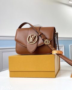 LOUIS VUITTON Pont 9. Authentic quality luxury bag crafted in genuine leather comes with authenticity card, dust bag and gift bag. Elevate your style with sophistication and grace. The LV Pont 9 handbag features elegantly structured and gracefully curved lines, crafted from luxurious smooth leather. A timeless House signature, the LV Circle, has been reimagined by the creative mind of Nicolas Ghesquière, embellishing both the bag's flap and the buckle of its adjustable strap. Exuding a touch of hidden elegance, the interior surprises with a colored leather lining and a Monogram Flower magnetic closure discreetly placed beneath the flap. - KRIS + KIKO LOUIS VUITTON Pont 9. Original Quality Bag including gift box, literature, dust bag, authenticity card. The structured yet curved lines of the LV Pont 9 handbag are fashioned from smooth leather. The LV Circle, a classic House signature reinterpreted by Nicolas Ghesquière, adorns the bag’s flap and the adjustable strap’s buckle. Hidden features such as a colored leather lining and Monogram Flower magnetic closure on the flap’s underside bring subtle sophistication.