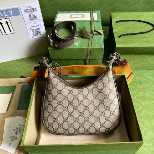 GUCCI Attache Small Shoulder Bag.  Authentic quality luxury bag crafted in genuine leather comes with authenticity card, dust bag and gift bag. Embrace timeless elegance with Gucci Love Parade - where Hollywood glamour and vintage charm unite. *ucci Love Parade pays homage to the enduring allure of Hollywood glamour by incorporating classic elements from the House's rich archives. The accessory, characterized by its elegant crescent moon shape, is adorned with a distinctive G shaped hook closure, adding to its unique charm. Crafted from luxurious materials and featuring heritage hardware, this exquisite design exudes a refined and timeless aesthetic, reminiscent of vintage beauty.
