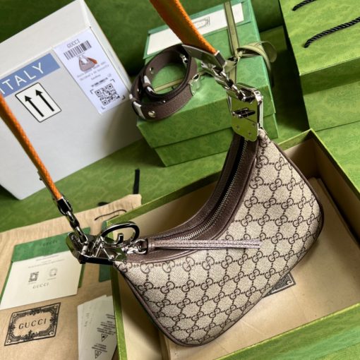 GUCCI Attache Small Shoulder Bag.  Authentic quality luxury bag crafted in genuine leather comes with authenticity card, dust bag and gift bag. Embrace timeless elegance with Gucci Love Parade - where Hollywood glamour and vintage charm unite. *ucci Love Parade pays homage to the enduring allure of Hollywood glamour by incorporating classic elements from the House's rich archives. The accessory, characterized by its elegant crescent moon shape, is adorned with a distinctive G shaped hook closure, adding to its unique charm. Crafted from luxurious materials and featuring heritage hardware, this exquisite design exudes a refined and timeless aesthetic, reminiscent of vintage beauty.