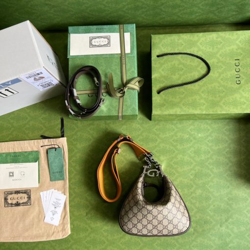 GUCCI Attache Small Shoulder Bag.  Authentic quality luxury bag crafted in genuine leather comes with authenticity card, dust bag and gift bag. Embrace timeless elegance with Gucci Love Parade - where Hollywood glamour and vintage charm unite. *ucci Love Parade pays homage to the enduring allure of Hollywood glamour by incorporating classic elements from the House's rich archives. The accessory, characterized by its elegant crescent moon shape, is adorned with a distinctive G shaped hook closure, adding to its unique charm. Crafted from luxurious materials and featuring heritage hardware, this exquisite design exudes a refined and timeless aesthetic, reminiscent of vintage beauty.
