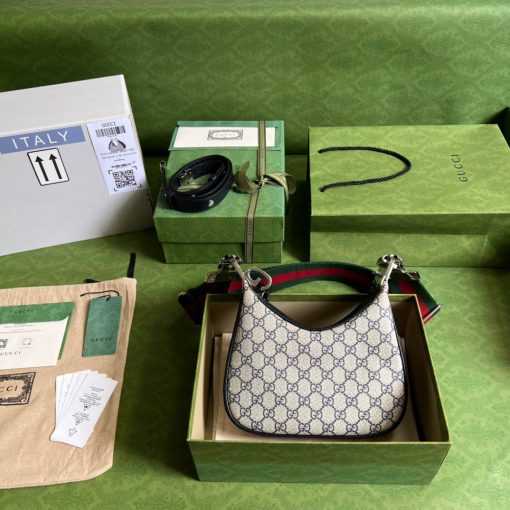 GUCCI Attache Small Shoulder Bag.  Authentic quality luxury bag crafted in genuine leather comes with authenticity card, dust bag and gift bag. Embrace timeless elegance with Gucci Love Parade - where Hollywood glamour and vintage charm unite. *ucci Love Parade pays homage to the enduring allure of Hollywood glamour by incorporating classic elements from the House's rich archives. The accessory, characterized by its elegant crescent moon shape, is adorned with a distinctive G shaped hook closure, adding to its unique charm. Crafted from luxurious materials and featuring heritage hardware, this exquisite design exudes a refined and timeless aesthetic, reminiscent of vintage beauty.