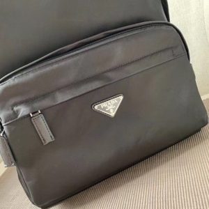 PRADA Black Logo Plaque Nylon and Saffiano Leather Backpack. Authentic quality luxury bag crafted in genuine leather comes with authenticity card, dust bag and gift bag. Practicality meets style, and carrying everything becomes effortlessly chic. Practicality is of utmost importance, while style is also highly valued. This backpack from Prada beautifully combines both aspects, featuring intricate details such as the brand's iconic enameled triangle logo plaque on the front that adds an extra touch of sophistication. It is the ideal choice for those occasions when you need to carry all your essentials and more. Truly the best of both worlds. - KRIS + KIKO PRADA Black Logo Plaque Nylon and Saffiano Leather Backpack. Authentic quality luxury bag crafted in genuine leather comes with authenticity card, dust bag and gift bag. Practicality meets style, and carrying everything becomes effortlessly chic. Practicality is of utmost importance, while style is also highly valued. This backpack from Prada beautifully combines both aspects, featuring intricate details such as the brand's iconic enameled triangle logo plaque on the front that adds an extra touch of sophistication. It is the ideal choice for those occasions when you need to carry all your essentials and more. Truly the best of both worlds.