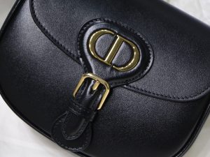 DIOR Small Bobby Bag. Authentic quality luxury bag crafted in genuine leather comes with authenticity card, dust bag and gift bag. Functionality Meets Elegance in Perfect Harmony. Maria Grazia Chiuri has introduced a new addition to the prestigious French fashion house's collection of iconic bags: the Dior Bobby. This stylish bag pays tribute to the owner's beloved pet pooch and showcases a new silhouette that resembles the D-fence bag, featuring the timeless CD logo. The Dior Bobby is the epitome of functionality and elegance, providing the perfect size for fashionable individuals who want to make a statement. With its practical shoulder strap, this sassy bag is perfectly suited to meet the demands of modern life. Its feminine curves and discreet "30 Montaigne" inscription on the back serve as a gentle nod to the renowned symbolic bag that shares its name. - KRIS + KIKO DIOR Small Bobby Bag. Authentic quality luxury bag crafted in genuine leather comes with authenticity card, dust bag and gift bag. Functionality Meets Elegance in Perfect Harmony. Maria Grazia Chiuri has introduced a new addition to the prestigious French fashion house's collection of iconic bags: the Dior Bobby. This stylish bag pays tribute to the owner's beloved pet pooch and showcases a new silhouette that resembles the D-fence bag, featuring the timeless CD logo. The Dior Bobby is the epitome of functionality and elegance, providing the perfect size for fashionable individuals who want to make a statement. With its practical shoulder strap, this sassy bag is perfectly suited to meet the demands of modern life. Its feminine curves and discreet "30 Montaigne" inscription on the back serve as a gentle nod to the renowned symbolic bag that shares its name.