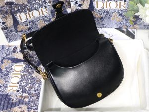 DIOR Small Bobby Bag. Authentic quality luxury bag crafted in genuine leather comes with authenticity card, dust bag and gift bag. Functionality Meets Elegance in Perfect Harmony. Maria Grazia Chiuri has introduced a new addition to the prestigious French fashion house's collection of iconic bags: the Dior Bobby. This stylish bag pays tribute to the owner's beloved pet pooch and showcases a new silhouette that resembles the D-fence bag, featuring the timeless CD logo. The Dior Bobby is the epitome of functionality and elegance, providing the perfect size for fashionable individuals who want to make a statement. With its practical shoulder strap, this sassy bag is perfectly suited to meet the demands of modern life. Its feminine curves and discreet "30 Montaigne" inscription on the back serve as a gentle nod to the renowned symbolic bag that shares its name.