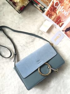 CHLOÉ 'Faye' Small Shoulder Bag. Authentic quality luxury bag crafted in genuine leather comes with authenticity card, dust bag and gift bag. Timeless style meets practicality. Combining functionality with elegance, the new Faye day bag embodies the Maison's nostalgic 70s aura. It boasts a practical magnet closure and spacious compartments, perfect for carrying all of your essentials. The double zips, accompanied by leather pullers, unveil suede gussets that create a delicate textural contrast and lend a feminine charm. Additionally, the bag features the line's distinctive ring loop and a hanging chain that exudes sophisticated hardware and a retro allure. - KRIS + KIKO CHLOÉ 'Faye' Small Shoulder Bag. Original Quality Bag including gift box, care book, dust bag, authenticity card. Functional yet elegant, the new Faye day bag taps into the Maison's 70s spirit while featuring a practical magnet closure and roomy compartments to carry all your belongings. Double zips with leather pullers open to reveal suede gussets for a subtle textural contrast adding a feminine touch. The line’s signature ring loop and hanging chain bring elegant hardware and retro appeal.