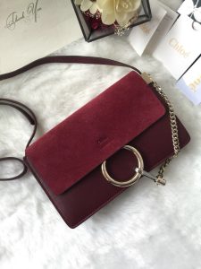 CHLOÉ 'Faye' Small Shoulder Bag. Authentic quality luxury bag crafted in genuine leather comes with authenticity card, dust bag and gift bag. Timeless style meets practicality. Combining functionality with elegance, the new Faye day bag embodies the Maison's nostalgic 70s aura. It boasts a practical magnet closure and spacious compartments, perfect for carrying all of your essentials. The double zips, accompanied by leather pullers, unveil suede gussets that create a delicate textural contrast and lend a feminine charm. Additionally, the bag features the line's distinctive ring loop and a hanging chain that exudes sophisticated hardware and a retro allure. - KRIS + KIKO CHLOÉ 'Faye' Small Shoulder Bag. Original Quality Bag including gift box, care book, dust bag, authenticity card. Functional yet elegant, the new Faye day bag taps into the Maison's 70s spirit while featuring a practical magnet closure and roomy compartments to carry all your belongings. Double zips with leather pullers open to reveal suede gussets for a subtle textural contrast adding a feminine touch. The line’s signature ring loop and hanging chain bring elegant hardware and retro appeal.