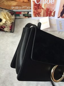 CHLOÉ 'Faye' Small Shoulder Bag. Authentic quality luxury bag crafted in genuine leather comes with authenticity card, dust bag and gift bag. Timeless style meets practicality. Combining functionality with elegance, the new Faye day bag embodies the Maison's nostalgic 70s aura. It boasts a practical magnet closure and spacious compartments, perfect for carrying all of your essentials. The double zips, accompanied by leather pullers, unveil suede gussets that create a delicate textural contrast and lend a feminine charm. Additionally, the bag features the line's distinctive ring loop and a hanging chain that exudes sophisticated hardware and a retro allure. - KRIS + KIKO CHLOÉ 'Faye' Small Shoulder Bag. Original Quality Bag including gift box, care book, dust bag, authenticity card. Functional yet elegant, the new Faye day bag taps into the Maison's 70s spirit while featuring a practical magnet closure and roomy compartments to carry all your belongings. Double zips with leather pullers open to reveal suede gussets for a subtle textural contrast adding a feminine touch. The line’s signature ring loop and hanging chain bring elegant hardware and retro appeal.