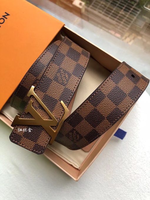 LOUIS VUITTON LV Initiales Belt 40 mm. Authentic quality luxury belt crafted in genuine leather comes with authenticity card, dust bag and gift bag. Unveiling a Striking Dichotomy of Elegance and Urbanity. Adorned with the signature Damier Cobalt canvas, the LV Initiales 40mm Reversible Belt effortlessly blends sophistication with an urban touch by seamlessly merging plain calf leather and iconic House motifs. Flaunting a versatile design, the plain leather side exudes a refined elegance suitable for formal business affairs. On the flip side, the striking Damier or Monogram canvas amplifies the belt's metropolitan allure, making it an ideal choice for a contemporary and fashion-forward look.
