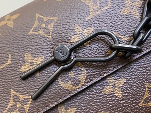 LOUIS VUITTON Steamer Wearable Wallet.  Authentic quality luxury wallet crafted in genuine leather comes with authenticity card, dust bag and gift bag. Style meets function: Elevate your everyday. The Steamer Wearable Wallet is a tasteful creation that draws inspiration from the timeless design codes of classic Steamer bags. Crafted with utmost precision, this wallet is constructed with durable Monogram Macassar canvas and features reinforced saffron leather corners for added strength. The use of black metal hardware, including rivets on the corners and a steamer-style chain, adds a touch of elegance to this piece. Rest assured, your valuables will be kept safe and organized with the inclusion of an inside zipped pocket.