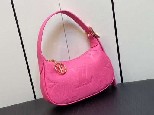 LOUIS VUITTON Mini Moon. Authentic quality luxury bag crafted in genuine leather comes with authenticity card, dust bag and gift bag. The Perfect Compact Bag for Every Occasion. Introducing the Mini Moon, a fashionable and compact micro bag with a shoulder strap, crafted from soft and supple Monogram Empreinte leather. The embossed Monogram pattern adds a touch of sophistication, beautifully adorned with oversized and luxurious details, including the iconic LV Circle signature on the zipper pull. Perfectly suited for both daytime and evening outings, this versatile bag can be effortlessly carried on your shoulder, arm, or even by hand, making it a must-have for storing your essentials.