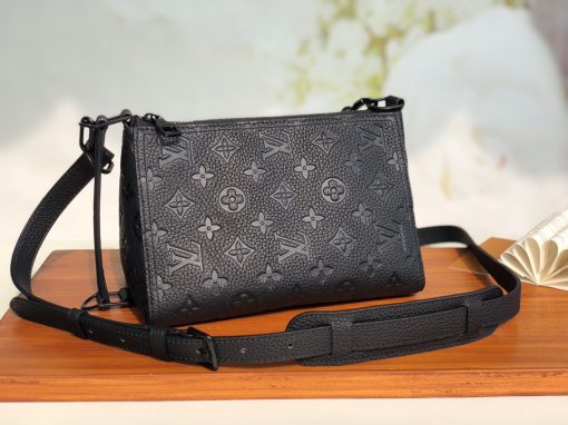 LOUIS VUITTON Triangle Messenger Bag. Original Quality Bag including gift box, care book, dust bag, authenticity card. Made from luxurious black Taurillon leather embossed with the Monogram motif, this Triangle Messenger bag is instantly recognizable by its unexpected triangular shape. The side and front leather straps allow both horizontal and vertical carry. Inspired by the design of the House’s Sac Tricot from 1934, Virgil Abloh has created a stylish small bag for men.