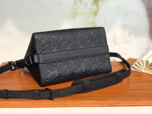LOUIS VUITTON Triangle Messenger Bag. Authentic quality luxury bag crafted in genuine leather comes with authenticity card, dust bag and gift bag. Redefining Style with Luxurious Flair! Crafted using exquisite black Taurillon leather adorned with the iconic Monogram pattern, the extraordinary Triangle Messenger bag boasts a distinctive triangular silhouette that captures attention effortlessly. Equipped with adjustable leather straps on the sides and front, it offers versatile carrying options, allowing both horizontal and vertical positions. Taking inspiration from the revered Sac Tricot originated in 1934, renowned designer Virgil Abloh has curated a fashionable and compact accessory perfectly suited for the modern man.