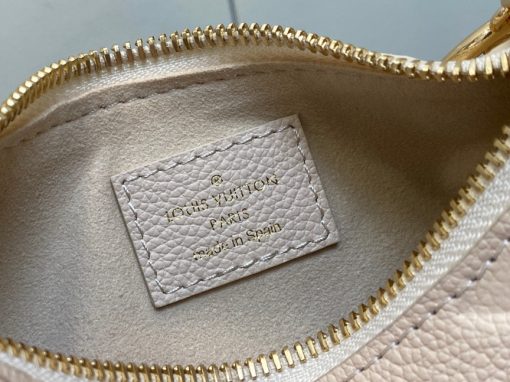 LOUIS VUITTON Mini Moon. Authentic quality luxury bag crafted in genuine leather comes with authenticity card, dust bag and gift bag. The Perfect Compact Bag for Every Occasion. Introducing the Mini Moon, a fashionable and compact micro bag with a shoulder strap, crafted from soft and supple Monogram Empreinte leather. The embossed Monogram pattern adds a touch of sophistication, beautifully adorned with oversized and luxurious details, including the iconic LV Circle signature on the zipper pull. Perfectly suited for both daytime and evening outings, this versatile bag can be effortlessly carried on your shoulder, arm, or even by hand, making it a must-have for storing your essentials.