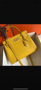 HERMÈS 'Kelly' Sellier Calf Leather Shoulder Bag. Authentic quality luxury bag crafted in genuine leather comes with authenticity card, dust bag and gift bag. Timeless Elegance, From Grace to Iconography. In 1930, a century after HERMÈS first opened its saddle-making workshops, Robert Dumas introduced a charming new creation for women - a small bag with straps. This bag featured a trapezoid shape, two triangular gussets, a sculpted flap, a handle, and ample storage space. Its design was simple and practical, tailored specifically for independent and energetic women. The bag with straps quickly became iconic for HERMÈS, embodying both desirability and discreetness. Then, in 1956, a significant moment occurred. Grace Kelly, the renowned Hollywood star turned princess, artfully concealed her baby bump behind her HERMÈS bag with straps. This image spread worldwide, instantly catapulting the bag into the limelight. And thus, the Kelly bag was born. - KRIS + KIKO HERMÈS 'Kelly' Sellier Calf Leather Shoulder Bag. Original Quality Bag. Gold-metal toned Hardware. HERMÈS Sales Box and Dust Bag. Booklet, Authenticity Card, Payment Slip. Lock, key clochette, and two keys are included. 1930, a century after the house of HERMÈS opened the doors of its saddle-making workshops, Robert Dumas created a small bag with straps for ladies. It had a trapezoid shape, two triangular gussets, a sculpted flap, a handle, and good storage space. Nothing fancy, just a neat, plain, functional bag intended for independent, energetic women. The ladies’ bag with straps was an emblematic HERMÈS design: both highly desirable yet anonymous. 1956, Grace Kelly, the Hollywood star who became a princess, hides her baby bump behind her Hermès bag with straps. The picture goes around the world, and the bag is instantly crowned. The Kelly bag is born.