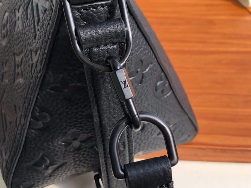 LOUIS VUITTON Triangle Messenger Bag. Authentic quality luxury bag crafted in genuine leather comes with authenticity card, dust bag and gift bag. Redefining Style with Luxurious Flair! Crafted using exquisite black Taurillon leather adorned with the iconic Monogram pattern, the extraordinary Triangle Messenger bag boasts a distinctive triangular silhouette that captures attention effortlessly. Equipped with adjustable leather straps on the sides and front, it offers versatile carrying options, allowing both horizontal and vertical positions. Taking inspiration from the revered Sac Tricot originated in 1934, renowned designer Virgil Abloh has curated a fashionable and compact accessory perfectly suited for the modern man.