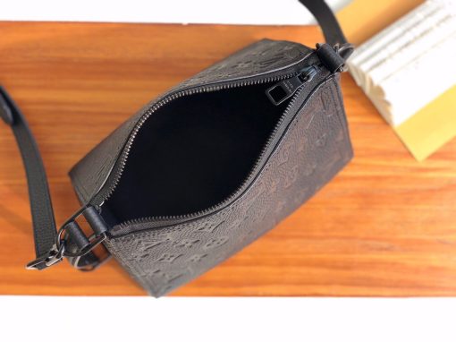 LOUIS VUITTON Triangle Messenger Bag. Original Quality Bag including gift box, care book, dust bag, authenticity card. Made from luxurious black Taurillon leather embossed with the Monogram motif, this Triangle Messenger bag is instantly recognizable by its unexpected triangular shape. The side and front leather straps allow both horizontal and vertical carry. Inspired by the design of the House’s Sac Tricot from 1934, Virgil Abloh has created a stylish small bag for men.