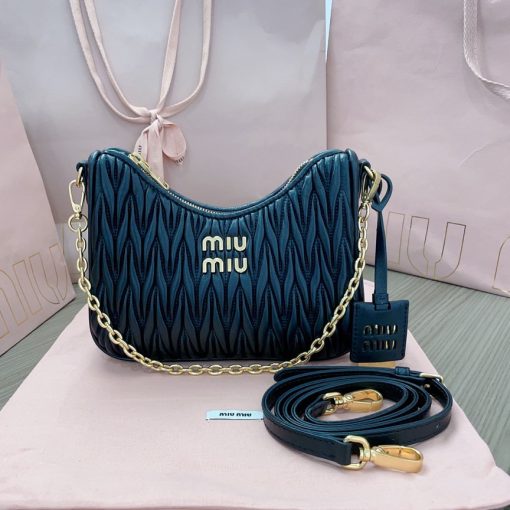 MIU MIU Matelassé Shoulder Bag. Authentic quality luxury bag crafted in genuine leather comes with authenticity card, dust bag and gift bag. Elevate your style with sophistication and craftsmanship. The exquisite matelassé technique exudes elegance and creates a visually captivating, multi-dimensional effect on this nappa leather shoulder bag. The beautifully crafted logo, reflecting the various metallic finishes of the hardware, effortlessly catches the eye, adding a touch of distinction to the immaculate artisanal work. Both functional and aesthetically pleasing, the detachable chain and leather shoulder straps perfectly meet your needs.